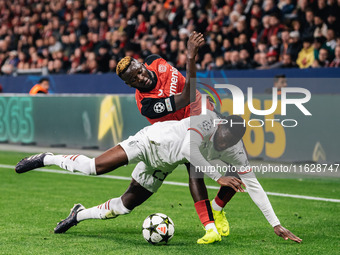 Victor Boniface of Bayer 04 Leverkusen and Fikayo Tomori of AC Milan are in action during the UEFA Champions League 2024/25 League Phase MD2...