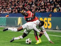 Victor Boniface of Bayer 04 Leverkusen and Fikayo Tomori of AC Milan are in action during the UEFA Champions League 2024/25 League Phase MD2...