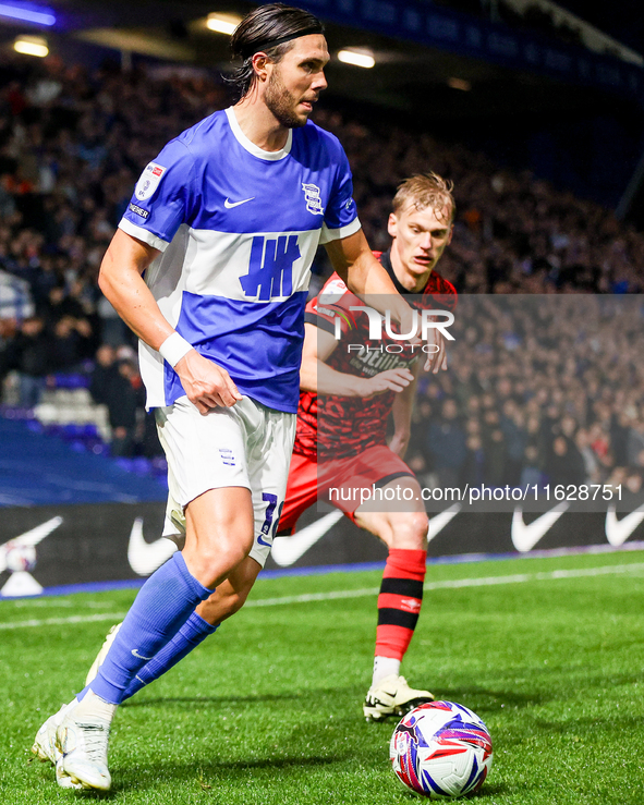 #18, Willum Por Willumsson of Birmingham is chased by #2, Lasse Sorensen of Huddersfield during the Sky Bet League 1 match between Birmingha...