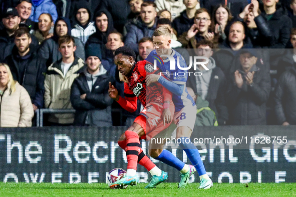 #14, Mickel Miller of Huddersfield is pressed by #28, Jay Stansfield of Birmingham during the Sky Bet League 1 match between Birmingham City...