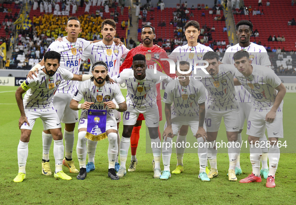 Players of Al Ain FC pose for a team photo before the AFC Champions League elite west football match between Qatar's Al Gharafa SC and Unite...