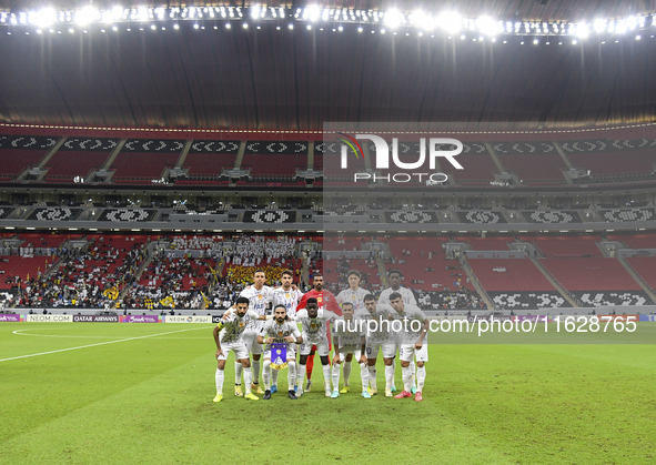 Players of Al Ain FC pose for a team photo before the AFC Champions League elite west football match between Qatar's Al Gharafa SC and Unite...