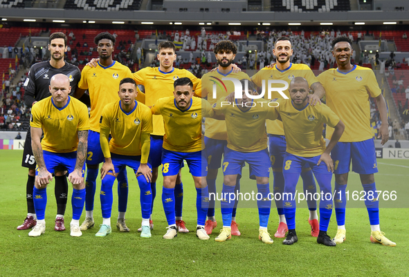 Players of Al Gharafa SC pose for a team photo before the AFC Champions League elite west football match between Qatar's Al Gharafa SC and U...