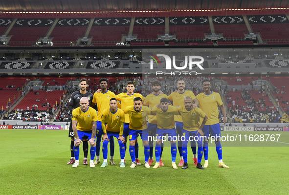 Players of Al Gharafa SC pose for a team photo before the AFC Champions League elite west football match between Qatar's Al Gharafa SC and U...