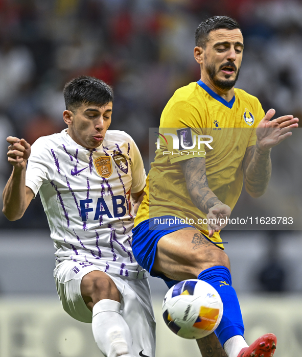 Jose Luis Mato of Al Gharafa SC battles for the ball with Mateo Sanabria of Al Ain FC during the AFC Champions League elite west football ma...