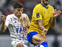 Jose Luis Mato of Al Gharafa SC battles for the ball with Mateo Sanabria of Al Ain FC during the AFC Champions League elite west football ma...