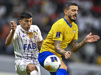 Jose Luis Mato of Al Gharafa SC battles for the ball with Mateo Sanabria of Al Ain FC during the AFC Champions League elite west football ma...