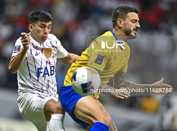 Jose Luis Mato of Al Gharafa SC battles for the ball with Mateo Sanabria of Al Ain FC during the AFC Champions League elite west football ma...