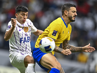 Jose Luis Mato of Al Gharafa SC battles for the ball with Mateo Sanabria of Al Ain FC during the AFC Champions League elite west football ma...