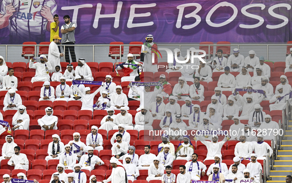 Al Ain FC supporters cheer for their team during the AFC Champions League elite west football match between Qatar's Al Gharafa SC and United...