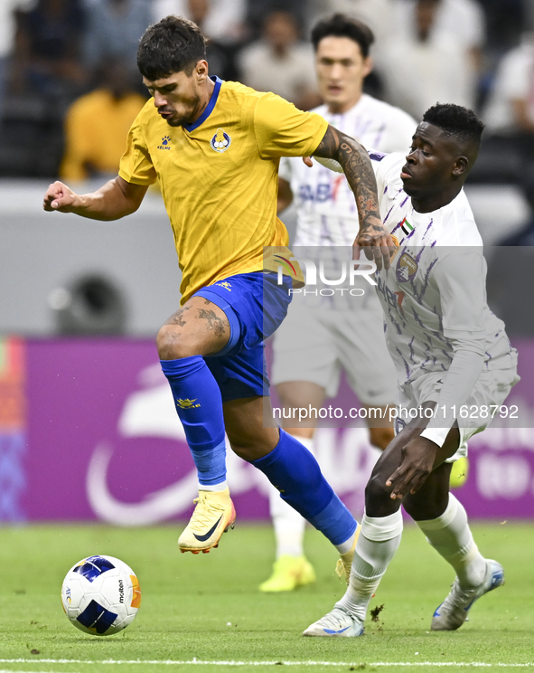 Florinel Teodor Coman (L) of Al Gharafa SC and Mateo Sanabria of Abdoul Karim Traore are in action during the AFC Champions League elite wes...