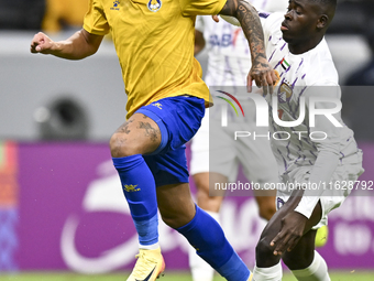 Florinel Teodor Coman (L) of Al Gharafa SC and Mateo Sanabria of Abdoul Karim Traore are in action during the AFC Champions League elite wes...