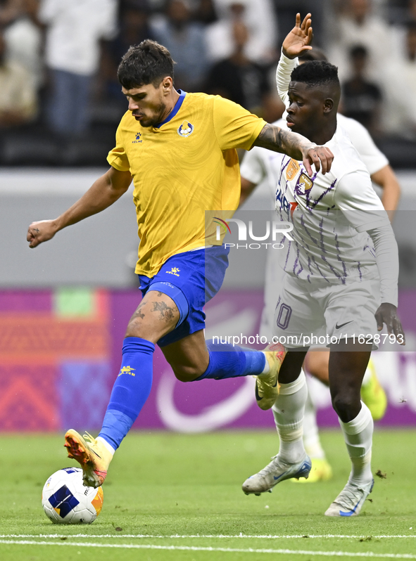 Florinel Teodor Coman (L) of Al Gharafa SC and Mateo Sanabria of Abdoul Karim Traore are in action during the AFC Champions League elite wes...