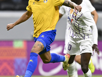 Florinel Teodor Coman (L) of Al Gharafa SC and Mateo Sanabria of Abdoul Karim Traore are in action during the AFC Champions League elite wes...