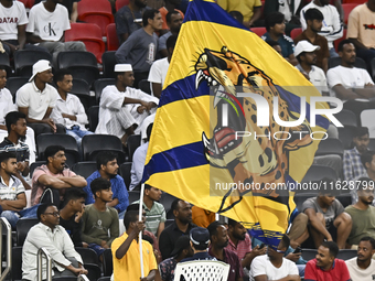 Al Gharafa SC supporters cheer for their team during the AFC Champions League elite west football match between Qatar's Al Gharafa SC and Un...