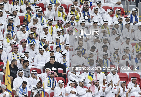 Al Gharafa SC supporters cheer for their team during the AFC Champions League elite west football match between Qatar's Al Gharafa SC and Un...