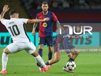 Pedri and Kastriot Imeri play during the match between FC Barcelona and BSC Young Boys in the week 2 of the League Stage of the UEFA Champio...