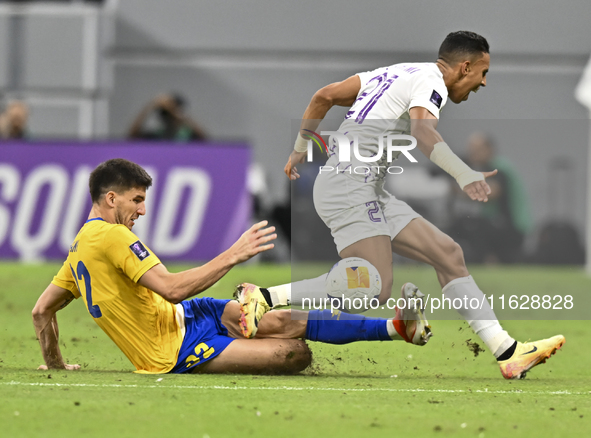 Matias Nani of Al Gharafa SC battles for the ball with Soufiane Rahimi of Al Ain FC during the AFC Champions League elite west football matc...