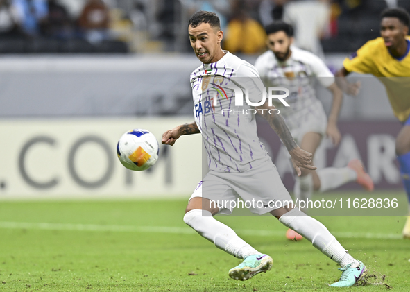 Kaku of Al Ain FC takes a penalty to score a goal during the AFC Champions League elite west football match between Qatar's Al Gharafa SC an...