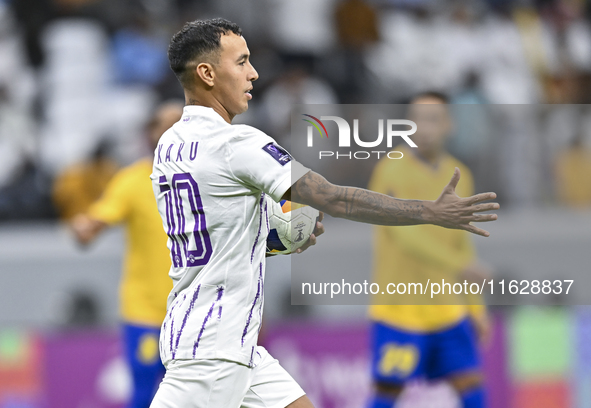 Kaku of Al Ain FC celebrates after scoring a goal during the AFC Champions League elite west football match between Qatar's Al Gharafa SC an...