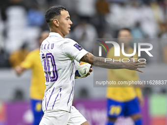 Kaku of Al Ain FC celebrates after scoring a goal during the AFC Champions League elite west football match between Qatar's Al Gharafa SC an...