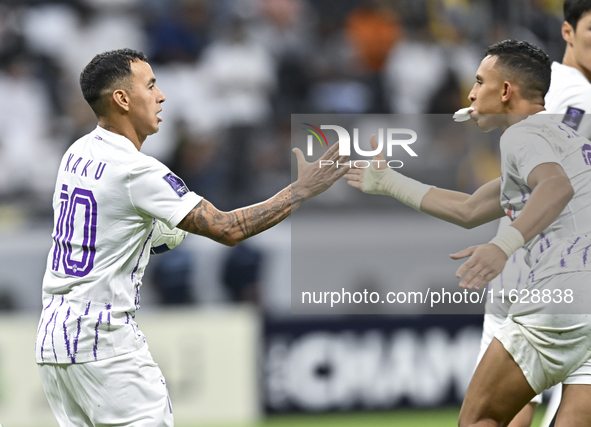 Kaku of Al Ain FC celebrates after scoring a goal during the AFC Champions League elite west football match between Qatar's Al Gharafa SC an...