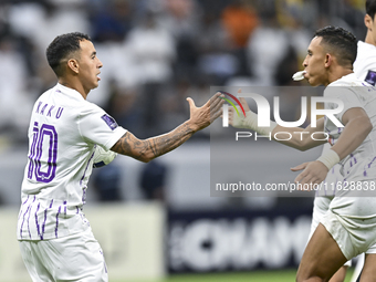 Kaku of Al Ain FC celebrates after scoring a goal during the AFC Champions League elite west football match between Qatar's Al Gharafa SC an...