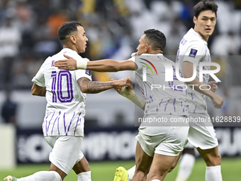 Kaku of Al Ain FC celebrates after scoring a goal during the AFC Champions League elite west football match between Qatar's Al Gharafa SC an...