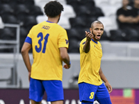 Yacine Brahimi (R) of Al Gharafa SC celebrates after scoring a goal during the AFC Champions League elite west football match between Qatar'...