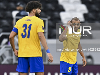 Yacine Brahimi (R) of Al Gharafa SC celebrates after scoring a goal during the AFC Champions League elite west football match between Qatar'...