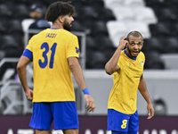 Yacine Brahimi (R) of Al Gharafa SC celebrates after scoring a goal during the AFC Champions League elite west football match between Qatar'...