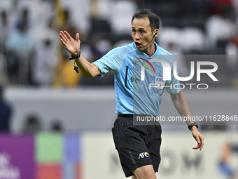 Japanese referee Hiroyuki Kimura gestures during the AFC Champions League elite west football match between Qatar's Al Gharafa SC and United...