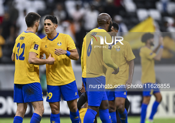 Players of Al Gharafa SC celebrate after winning the AFC Champions League elite west football match between Qatar's Al Gharafa SC and United...