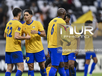 Players of Al Gharafa SC celebrate after winning the AFC Champions League elite west football match between Qatar's Al Gharafa SC and United...