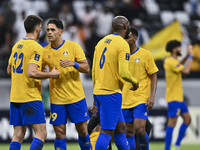 Players of Al Gharafa SC celebrate after winning the AFC Champions League elite west football match between Qatar's Al Gharafa SC and United...