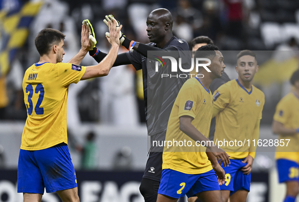 Players of Al Gharafa SC celebrate after winning the AFC Champions League elite west football match between Qatar's Al Gharafa SC and United...