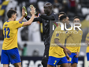 Players of Al Gharafa SC celebrate after winning the AFC Champions League elite west football match between Qatar's Al Gharafa SC and United...