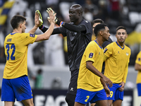 Players of Al Gharafa SC celebrate after winning the AFC Champions League elite west football match between Qatar's Al Gharafa SC and United...