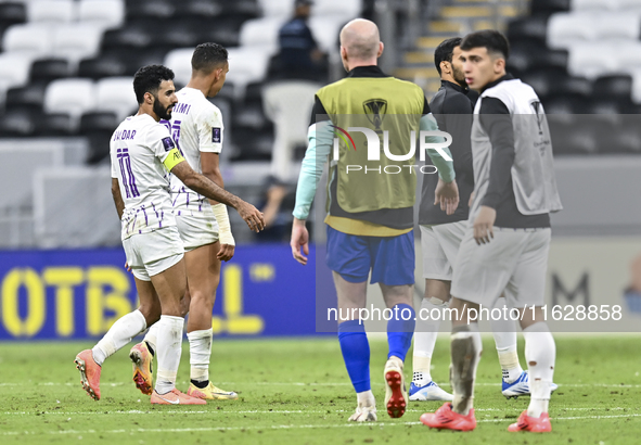 Players of Al Ain FC express their dejection after the AFC Champions League elite west football match between Qatar's Al Gharafa SC and Unit...