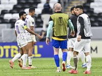 Players of Al Ain FC express their dejection after the AFC Champions League elite west football match between Qatar's Al Gharafa SC and Unit...