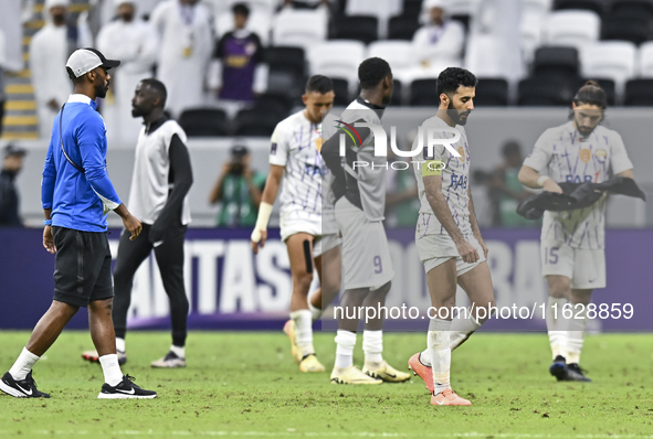 Players of Al Ain FC express their dejection after the AFC Champions League elite west football match between Qatar's Al Gharafa SC and Unit...