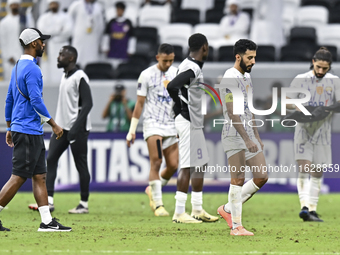 Players of Al Ain FC express their dejection after the AFC Champions League elite west football match between Qatar's Al Gharafa SC and Unit...