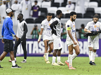 Players of Al Ain FC express their dejection after the AFC Champions League elite west football match between Qatar's Al Gharafa SC and Unit...