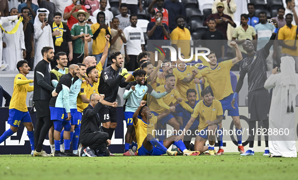 Players of Al Gharafa SC celebrate after winning the AFC Champions League elite west football match between Qatar's Al Gharafa SC and United...