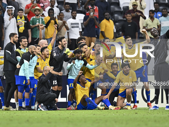 Players of Al Gharafa SC celebrate after winning the AFC Champions League elite west football match between Qatar's Al Gharafa SC and United...