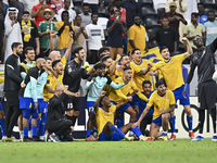 Players of Al Gharafa SC celebrate after winning the AFC Champions League elite west football match between Qatar's Al Gharafa SC and United...