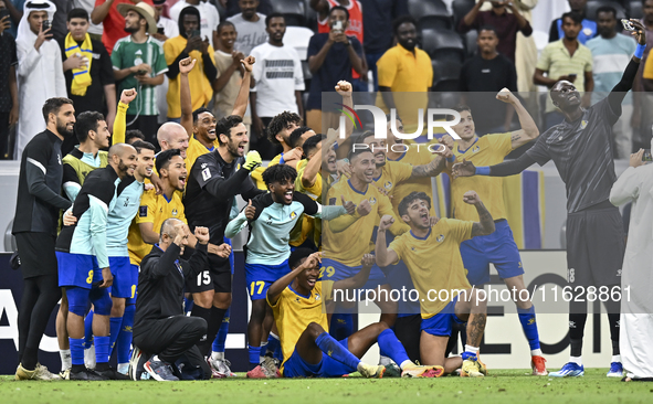 Players of Al Gharafa SC celebrate after winning the AFC Champions League elite west football match between Qatar's Al Gharafa SC and United...