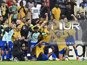 Players of Al Gharafa SC celebrate after winning the AFC Champions League elite west football match between Qatar's Al Gharafa SC and United...