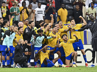 Players of Al Gharafa SC celebrate after winning the AFC Champions League elite west football match between Qatar's Al Gharafa SC and United...