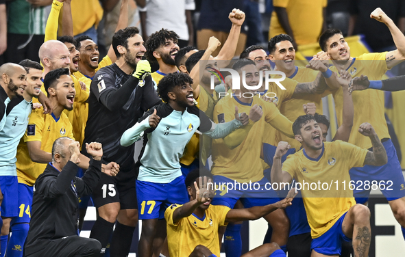 Players of Al Gharafa SC celebrate after winning the AFC Champions League elite west football match between Qatar's Al Gharafa SC and United...